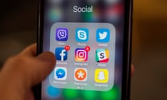 Social media app icons on a smartphone screen