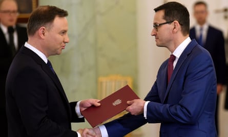 Poland’s president, Andrzej Duda (left), designates Mateusz Morawiecki as the new prime minister in the presidential palace in Warsaw