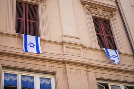 Israeli flags draped over a window in the Jewish quarter of Rome amid heightened security last week.