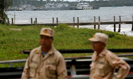 Sailors stand guard at the Ream naval base in Sihanoukville in Cambodia.