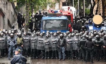 Georgian law enforcement officers are seen deployed on streets of Tbilisi.