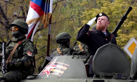 Arseny Pavlov, known as ‘Motorola’, saluting while taking part in a military parade.