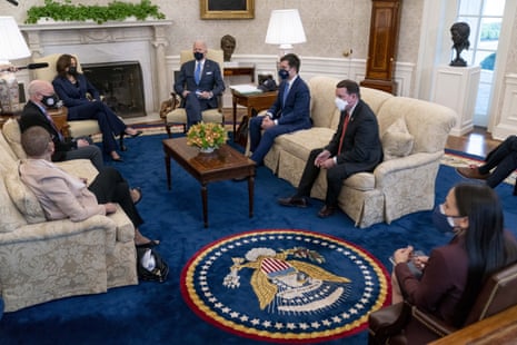 Joe Biden, Kamala Harris, Pete Buttigieg and members of the House of Representatives meet in the Oval Office.