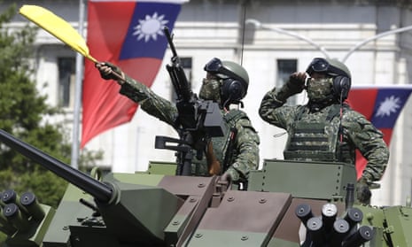 Taiwanese soldiers salute during a national day parade at which president Tsai Ing-wen said the island would not bow to Chinese pressure.