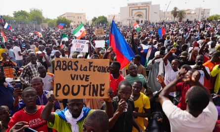 Nigeriens participate in a march called by supporters of coup leader Gen Abdourahmane Tchiani in Niamey