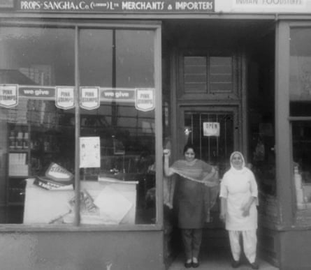 Pritam Singh Sangha’s wife, Bakshish Kaur Sangha (left), and his mother outside the family shop circa 1958.