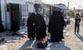 Image obtained Saturday, October 5, 2019 of women buying food at the ?Iraqi market? in Al Hawl camp, Syria. The majority of women still wear full Islamic dress in order to avoid violence or death by still radicalised women. (AAP Image/Tessa Fox) NO ARCHIVING