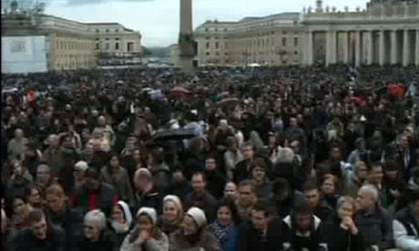 A large crowd waits in St Peter's Square for news from the papal conclave on 13 March 2013.