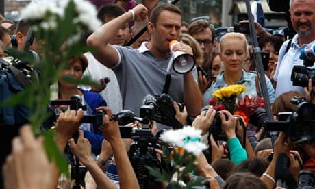 Russian opposition leader Alexei Navalny addresses supporters and media after arriving in Moscow