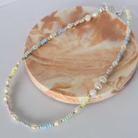 dainty pastel necklace featuring pastel rainbow beads and freshwater pearls
