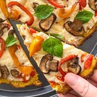 This vegan polenta pizza crust is quicker to make than wheat dough with the added benefit of being gluten free too!