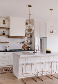 BECKI OWENS- Villa Bonita Kitchen Reveal! White and wood kitchen, mix metals, Brizo Artesso Bridge Faucet.