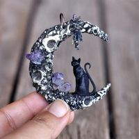 MADE TO ORDER We sculpted this lovely black cat model to make a mold at first. So, we cast all black cat bralecets and pendants cat charms by using the mold that is made by Umay Designs. Black cat miniature models and Crater Sailor moon are made of a kind of resin. We painted this