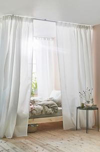 IKEA VIDGA white room corner dividers can help create a sense of privacy in your bedroom.