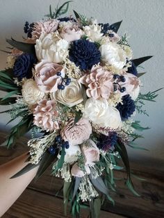 a bridal bouquet with blue and white flowers