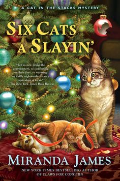 the cover of six cats as slayin'by miranda james, featuring two kittens and a christmas tree