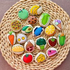 a wicker basket filled with lots of colorful rocks