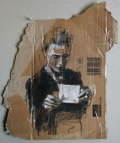 a piece of cardboard with a drawing of a man holding a cup