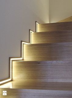 a close up of some stairs with light coming from the top and bottom one way
