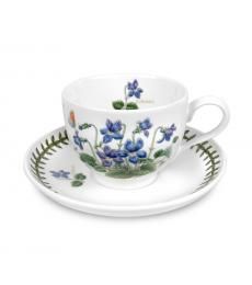 a cup and saucer decorated with blue flowers