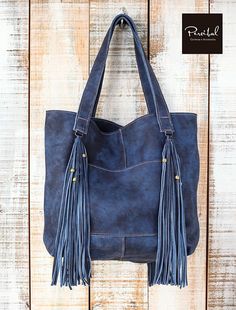 This is a very light leather tote made with a soft and distressed brown leather. INSIDE / OUTSIDE Inside: Unlined, w/one pocket without zipper. Outside: big pocket without zipper. Metallic clasp to close the bag. MEASURES Height: 14 in (36cm) / Width: 14 in (36 cm) / Depth: 5 in (13cm) / Distressed Leather Bag, Large Leather Tote, Leather Tote, Leather Shopper Bag, Shopper Bag, Leather Laptop Bag