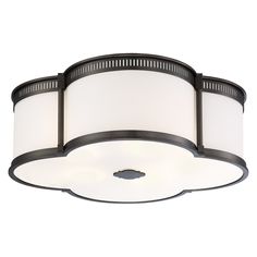 a ceiling light with two white shades on it