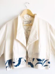Bolero coat - Bolero Jacket - Bolero blazer off white and deep blue embroidery Care of the product: -Hand or machine wash on a gentle wash cycle with cold water. -Preferably use dish detergent or detergent for delicate clothes. -Straighten and hang to dry. -Preferably Iron after dry so the item will keep its texture. -Can be dry-cleaned. -Do not bleach. Return or exchange Policies: Thanks so much for visiting my shop. My team of talented Otomi embroiderers and I put our heart and soul into these