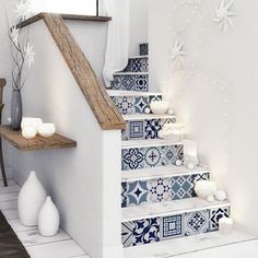 the stairs are decorated with blue and white tiles