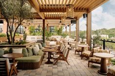 an outdoor seating area with tables and chairs