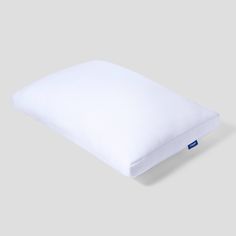 a white pillow on a gray background