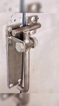 an image of a metal door handle on a wall