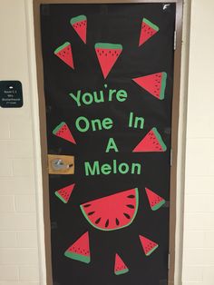a door decorated with watermelon slices and the words you're one in a melon