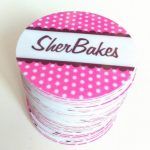 there is a pink and white polka dot covered box with the word sherb bakes on it