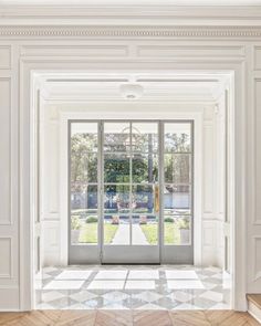 an open door leading into a white room