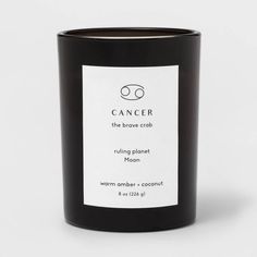 a black candle with the label on it