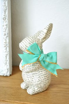 an image of a stuffed bunny with a bow on it's head and the caption says, easter bunny to my spring mantle isn't he sweet?