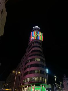 a large building that is lit up with colorful lights and the words campa on it