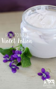 purple flowers sitting on top of a table next to a jar of white cream with the words how to make violet lotion