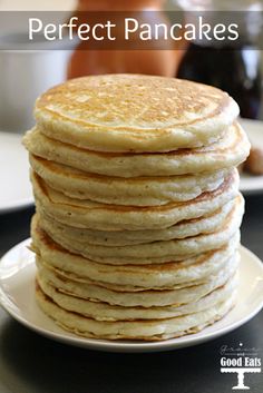 a stack of pancakes sitting on top of a white plate