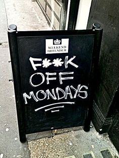 a sign on the side of a building that says, f k off mondays