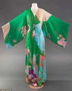 HANAE MORI SILK CHIFFON SUMMER GOWN Sold May 9, 2017 Sturbridge, Massachusetts 3-piece dress, caftan & scarf w/ print of water, butterflies, fish, various birds & flowers on grounds of emerald green & pink, pencil skirt of silk twill w/ same print, chiffon bodice w/ smocked midriff, kimono sleeves & gathered, open-front over skirt, B to 38", W to 30", L 60" Kimonos, Silk Twill, Piece Dress, Print Chiffon