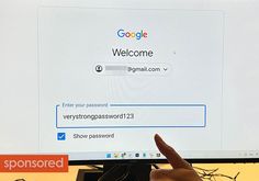 someone is pointing at the welcome screen on their computer