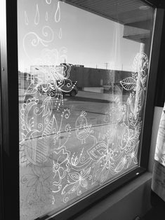 a window with flowers drawn on it
