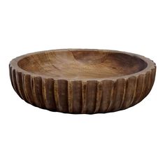 a wooden bowl sitting on top of a white surface