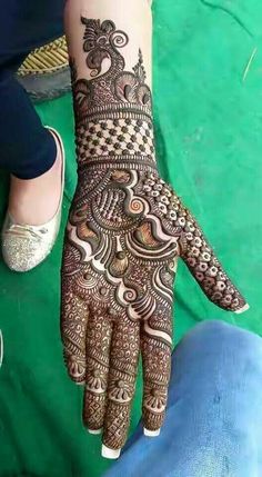 a person with henna on their hand