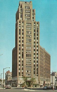 an old photo of a very tall building