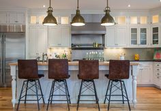 Kitchen Leather Counterstools. Classic white kitchen with leather counterstools. This white kitchen has a traditional look but it's layered with industrial and modern elements. #kitchen #counterstools Restyle Design, LLC. Industrial Design, Kitchen Designs, Bar Stools, Classic White Kitchen