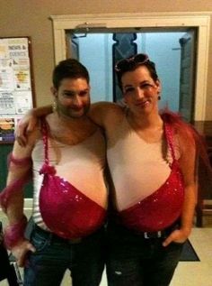 two people standing next to each other wearing bras