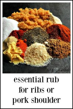 an assortment of spices and seasonings on top of a black surface with the words essential rub for ribs or pork shoulder