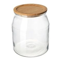 a glass jar with a wooden lid